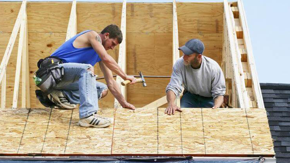 Professional roofing installation on residential home